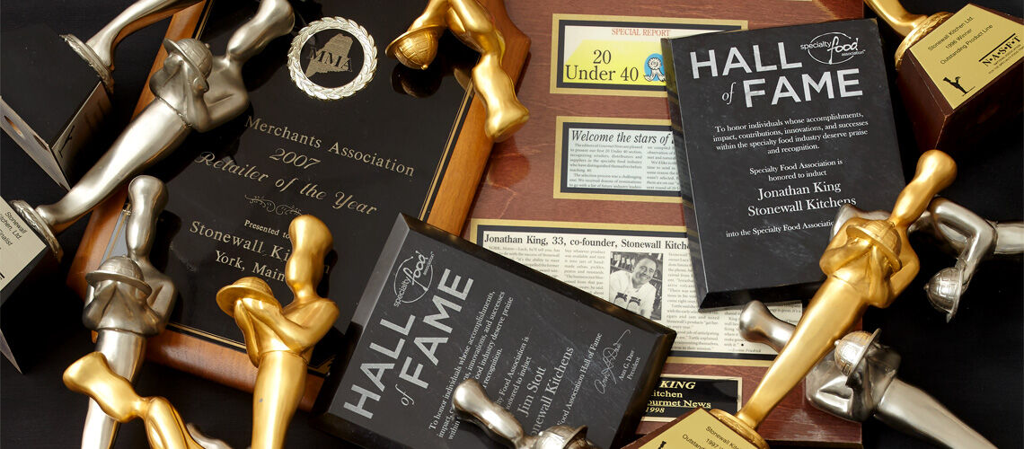 An assortment of Specialty Hall of Fame awards on a desk